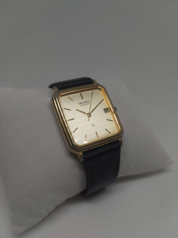 Vintage Orient Quartz Watch: Gold-tone Champagne Dial, Date