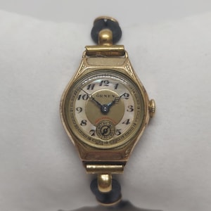 Rare montre femme vintage Örnen | Fabrication suisse | Couvercle Art Déco à charnière | Cadran unique | Années 30-40 | Remontage manuel | Objet de collection