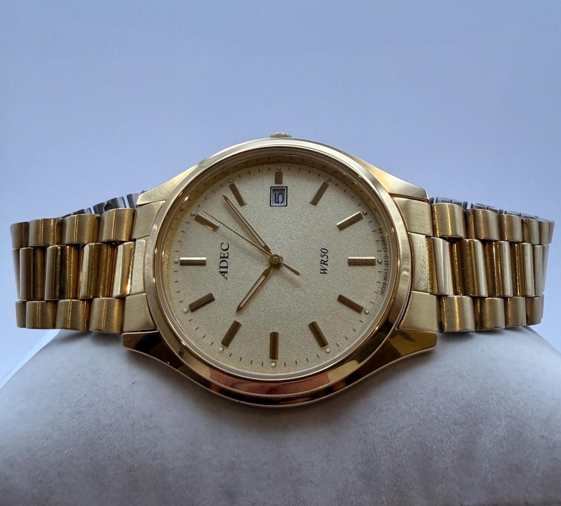 ADEC Quartz WR50 Date – Gold-tone 42mm, Textured Champagne Dial