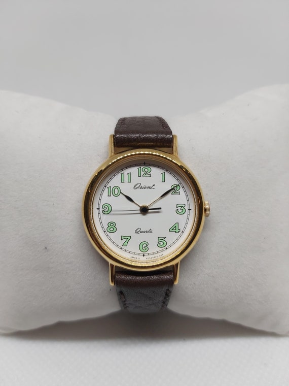 Vintage Orient Ladies Quartz Watch: Gold-tone Case, Green Arabic