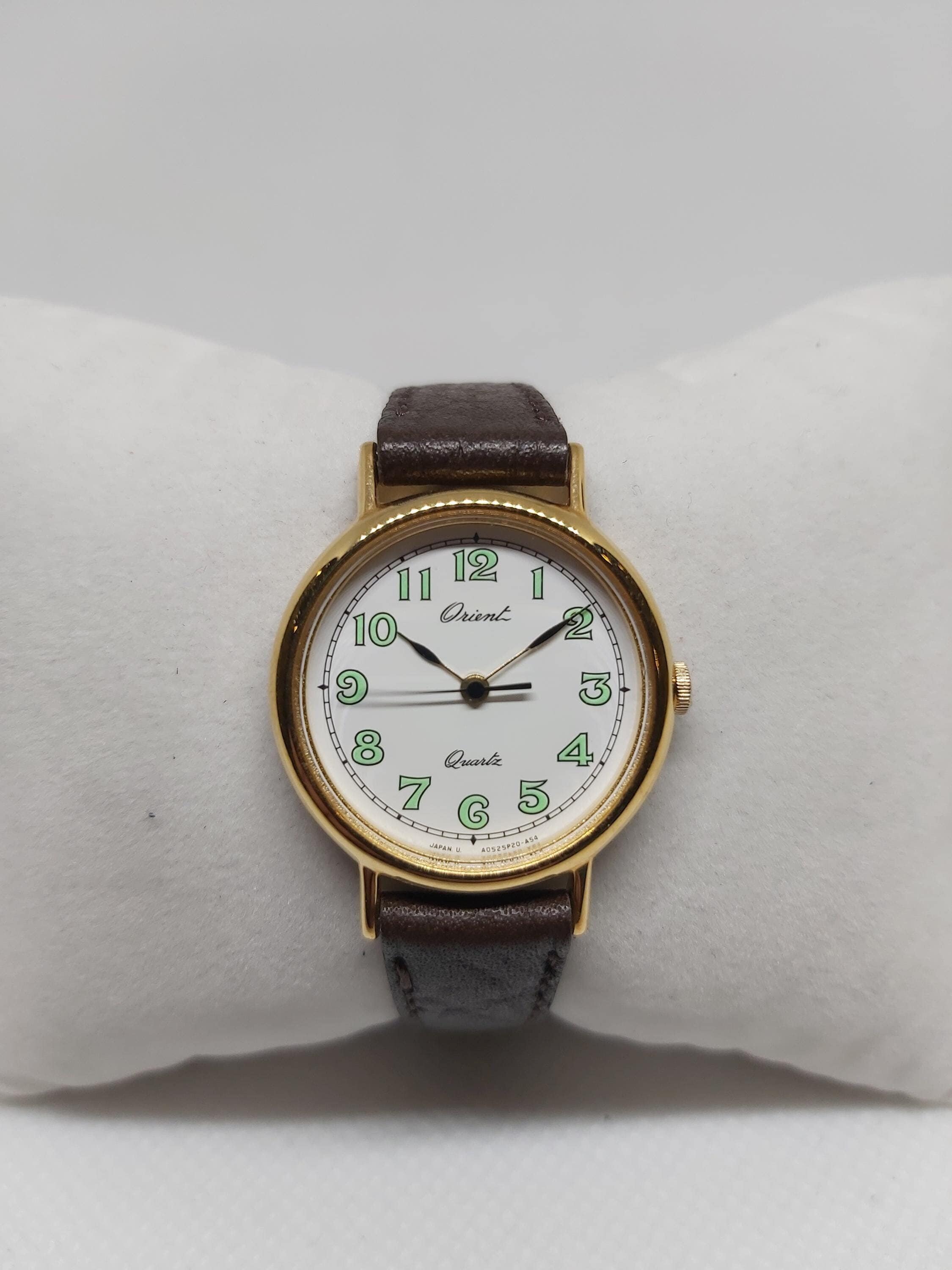 Vintage Orient Ladies Quartz Watch: Gold-tone Case, Green Arabic
