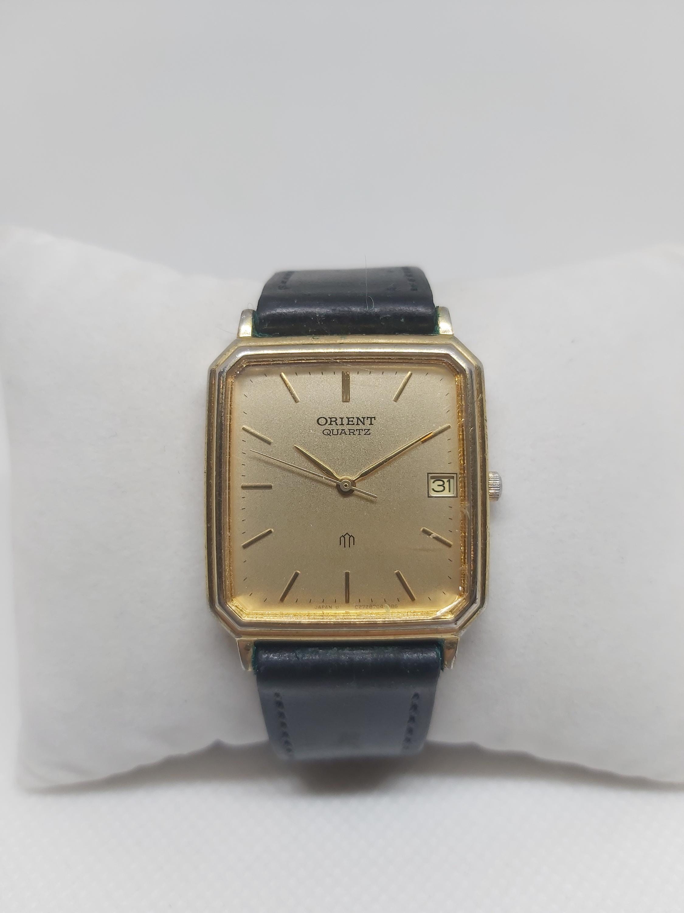 Vintage Orient Quartz Watch: Gold-tone Champagne Dial, Date