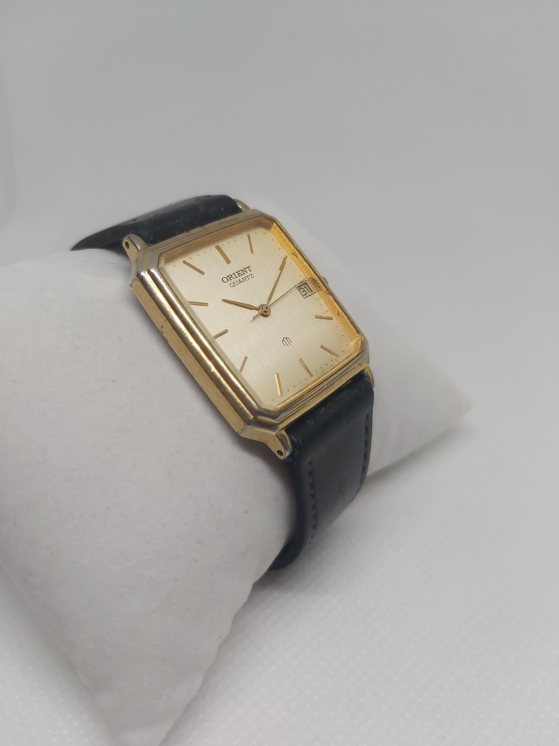 ビンテージオリエント時計GrandPrixOrient 14K Gold Vintage Orient Quartz Watch: Gold-tone Champagne Dial, Date Window