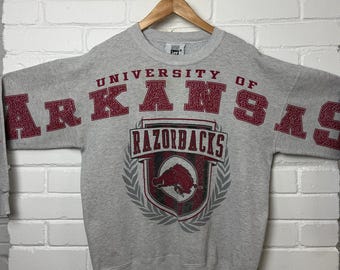 Vintage 90s Arkansas Razorbacks University Arm Spell Out Crest Graphic Crewneck Sweatshirt Size L