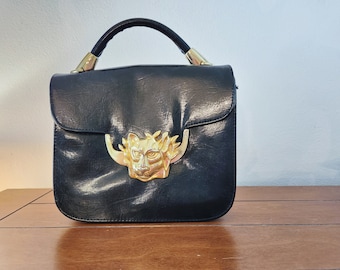 Vintage 1990's Black Sasha Handbag with Large Gold Lion Buckle Accent