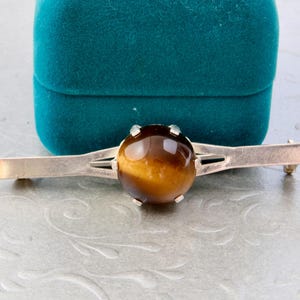 Tiger's eye sterling silver brooch, Long narrow brooch with brown tiger's eye, Silver brooch on the lapel of a jacket