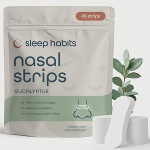 May include: A package of "sleep habits" nasal strips with "EUCALYPTUS" text. The package is white with green accents and contains 45 strips. The strips are white and are designed to open nasal passages, relieve congestion, and encourage restful sleep.