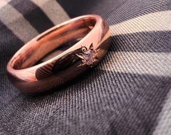 Solid 14k Rose Gold ring set with natural white diamond. Size 7