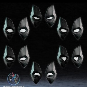 May include: A set of 10 black diamond-shaped masks with different white eye designs. The masks have a glossy finish and are arranged in a circle.