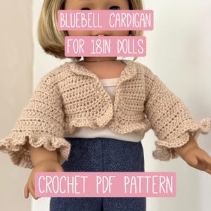May include: A beige crochet cardigan with ruffled sleeves and a scalloped edge, designed for 18-inch dolls. The text "BLUEBELL CARDIGAN FOR 18IN DOLLS" is displayed across the top of the image, and "CROCHET PDF PATTERN" is displayed at the bottom.