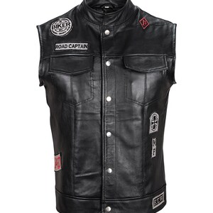 May include: Black leather motorcycle vest with multiple patches, including "Biker MC", "Road Captain", and "MF".