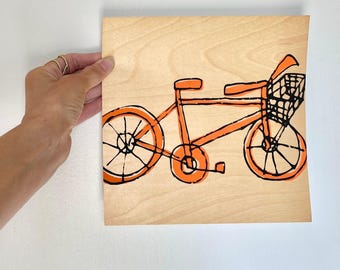 Originele zeefdruk van een oranje fiets op houtfineer, 8 x 8 cm