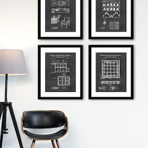 May include: Four black framed prints of vintage patent drawings on a white wall. Each print features a different design, including a chair, a greenhouse, and two different window designs. The prints are all in black and white and have a distressed look.