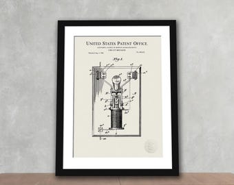 May include: Framed print of a vintage circuit breaker patent diagram. The diagram is in black and white, with detailed technical illustrations and text from the United States Patent Office. The print is in a black frame.