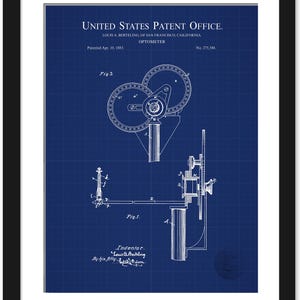 May include: Framed blueprint of an optometer patent from the United States Patent Office, dated April 10, 1883. The detailed technical drawing is in white on a blue grid background, with the inventor's name and patent number visible.