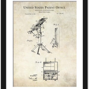 May include: Framed patent print of a drafting table, dated December 8, 1925, from the United States Patent Office. The print features detailed technical drawings of the table's design, including its adjustable features and supporting structure. The print is in black and white.
