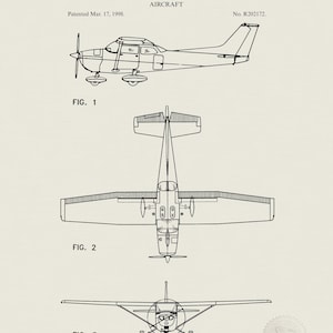 May include: Black and white patent illustration of a Cessna aircraft, with views from the side, top, and front. The text reads "United States Patent Office" and "Cessna Aircraft Company, of Wichita, Kansas." The patent date is March 17, 1998.
