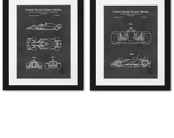 May include: Two black framed prints of a vintage patent drawing for a race car. The drawings are in white on a black background. The text "United States Patent Office" is at the top of each print.