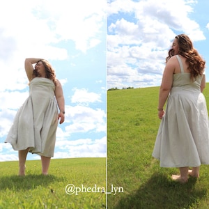 May include: A woman wearing a light-colored linen dress stands in a field with a blue sky and white clouds in the background. The dress has a simple, flowy design and is perfect for a summer day. The woman is smiling and looks happy. The image is captioned with the text "@phedralyn".