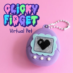 May include: A purple virtual pet toy with a screen showing a pixelated black heart. The toy has a light blue frame around the screen and three white buttons below. The text "CLICKY FIDGET Virtual Pet" is above the toy.