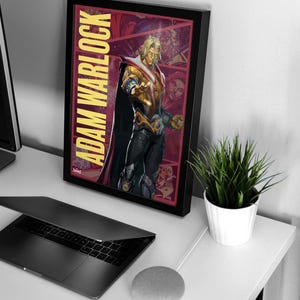 May include: A framed poster featuring Adam Warlock, a Marvel Comics superhero. The poster has a red and gold background with a comic book style design. The text "Adam Warlock" is written vertically in yellow letters on the left side of the poster.