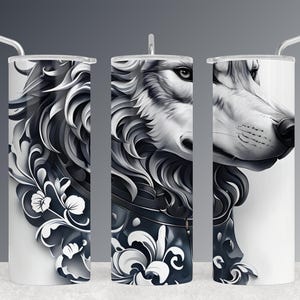 May include: Three stainless steel tumblers with a black and white wolf design. The wolf is surrounded by floral designs. The tumblers are all the same design but are shown from different angles.