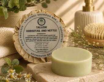 May include: A round, light green shampoo bar sits next to a wrapped bar labeled Wild Forest Tallow Horsetail and Nettle, listing ingredients including saponified food grade equisetum, nettle, beef tallow, sunflower oil, castor oil, and honey, 3.5 oz.