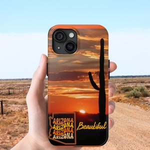 May include: A phone case with a sunset and a cactus silhouette. The text "Arizona Beautiful" is printed on the case.