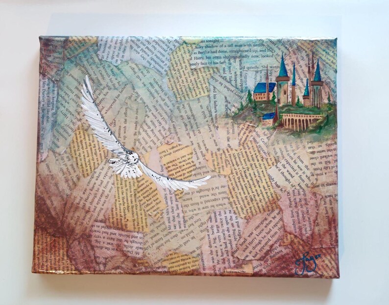 May include: A painting on canvas with a collage of old book pages. The painting features a white owl flying towards a blue and white castle with a brown stone bridge. The castle is surrounded by green trees and a blue sky. The painting is signed in the bottom right corner.
