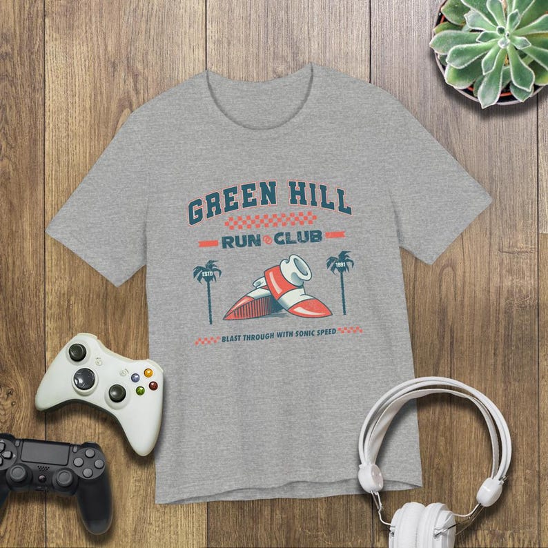 This is a Bella+Canvas 3001 Unisex Jersey Tee with the “Green Hill Run Club Funny Gamer Shirt for 90s Retro Video Game Fans” design on the front of the shirt. Image 3