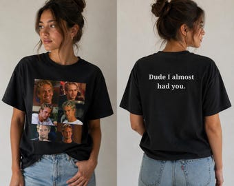 May include: Black t-shirt featuring a collage of images of a man. The front of the shirt displays six images of the man. The back of the shirt has the text "Dude I almost had you."