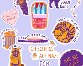 May include: A collection of colorful stickers with various designs and text. Designs include a cat, a raccoon, a sardine can, a ship, and a trash can. Text includes phrases like "Fascism Smells Kinda Fishy" and "Sea Rescue is Not a Crime."