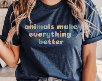 May include: A navy blue t-shirt with the text "animals make everything better" in rainbow colors.