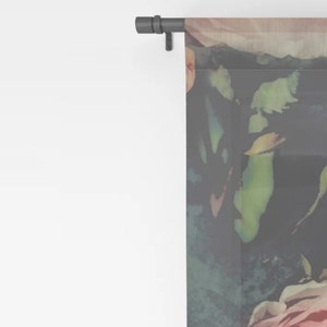 May include: A sheer curtain panel with a floral pattern featuring pink, green, and blue watercolor-style roses. The background is a dark gray.