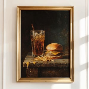 May include: A framed painting depicts a classic fast-food meal. A tall glass of cola with ice and a straw sits next to a cheeseburger and a pile of french fries. The painting has a dark background and a gold frame.
