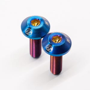 May include: Two blue titanium screws with gold accents and a rainbow finish.