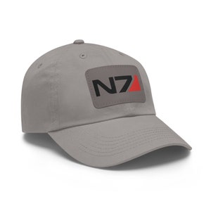 May include: A gray baseball cap with a black and red N7 patch on the front.