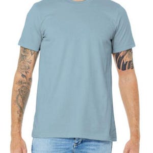 May include: A light blue t-shirt with short sleeves and a crew neck.