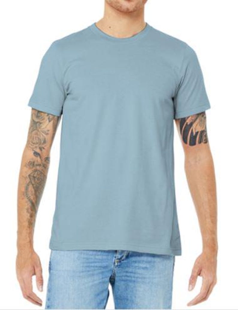 May include: A light blue t-shirt with short sleeves and a crew neck.