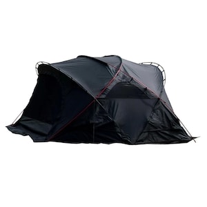 May include: A black camping tent with a distinctive geometric pattern. The tent has a series of connected panels and a curved roof. Red detailing is visible on the support poles. This tent is designed for outdoor camping and shelter.