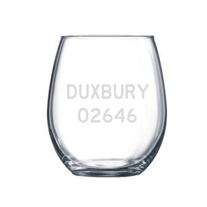 May include: A clear glass wine glass with the text "DUXBURY 02646" etched on the side.