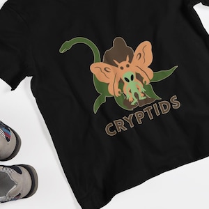 Cryptids Jugend Kurzarm-T-Shirt, Jungen, Mädchen, Cryptid, Natur, Natur, Bigfüße, Mothman, Loch Ness Monster, Aliens, UFO, Kreaturen