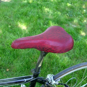 Bicycle Saddle Cover Dark Red Metallic fits saddles approx: 10L x 7W x 2H image 1