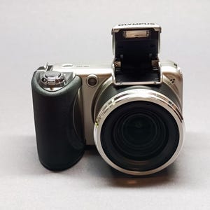 NEW! Olympus SP-600UZ 12.0MP Digital Camera - Silver - Never Used, Full Box