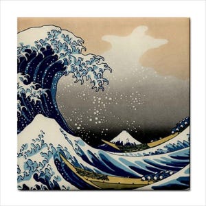 May include: A square print of Hokusai's "The Great Wave off Kanagawa." The artwork shows a large, curling wave with white foam, dark blue water, and Mount Fuji in the background. Small boats are visible in the wave's trough.