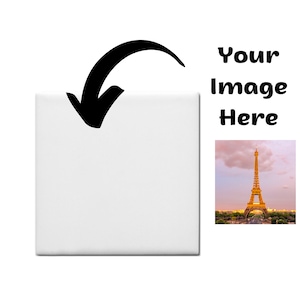 May include: A white square tile with a black arrow pointing down. The text "Your Image Here" is displayed in black, with a photograph of the Eiffel Tower in the background.