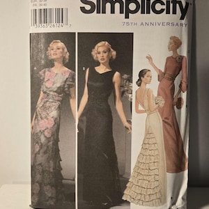 May include: Simplicity sewing pattern number 5876 for sizes 6, 8, 10, and 12. The pattern includes three different styles of dresses: a floral print dress with short sleeves, a black sleeveless dress, and a white dress with a ruffled skirt.