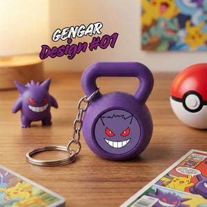 May include: A purple kettlebell keyring with a Gengar design, red eyes, and a white grin. The keyring is attached to a silver ring. The text "Gengar Design #01" is above the kettlebell. A Gengar figurine and a Poke Ball are also visible.