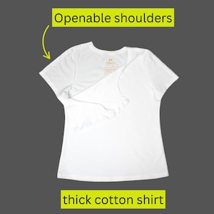 May include: A white, thick cotton shirt with openable shoulders. The shirt has short sleeves and a V-neck. The text "Openable shoulders" and "thick cotton shirt" are in yellow rectangles.