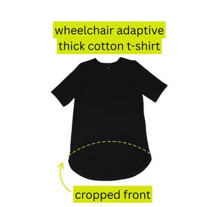May include: Black wheelchair adaptive thick cotton t-shirt with a cropped front design. The shirt has short sleeves and a rounded hemline. The text "wheelchair adaptive thick cotton t-shirt" is in a yellow rectangle.